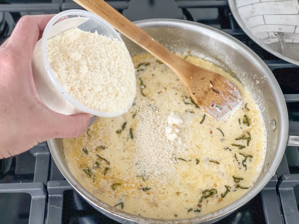 adding parmesan to skillet