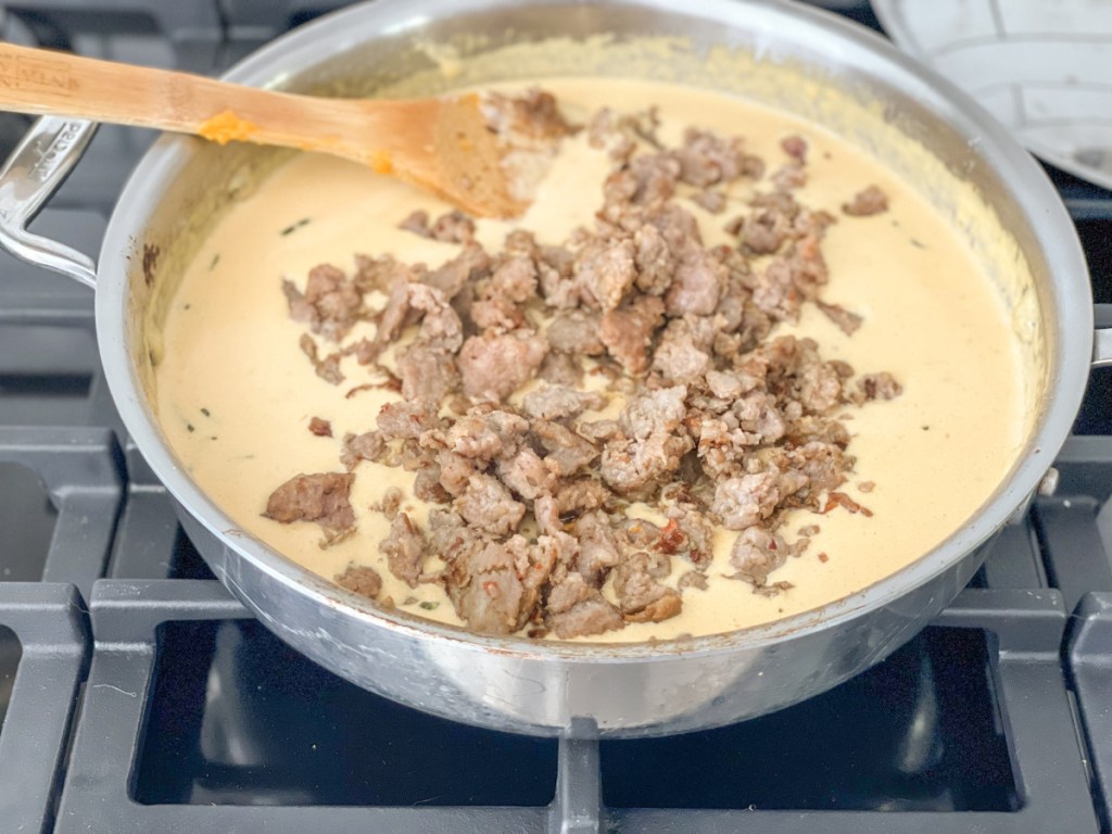 keto pumpkin Alfredo sauce with sausage in skillet