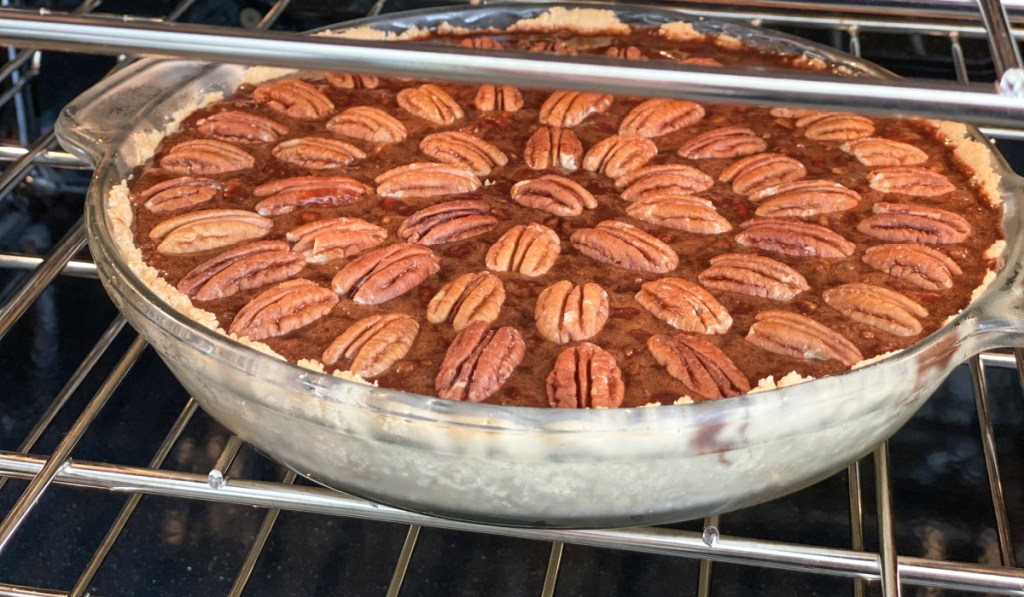 keto chocolate fudge pecan pie in the oven