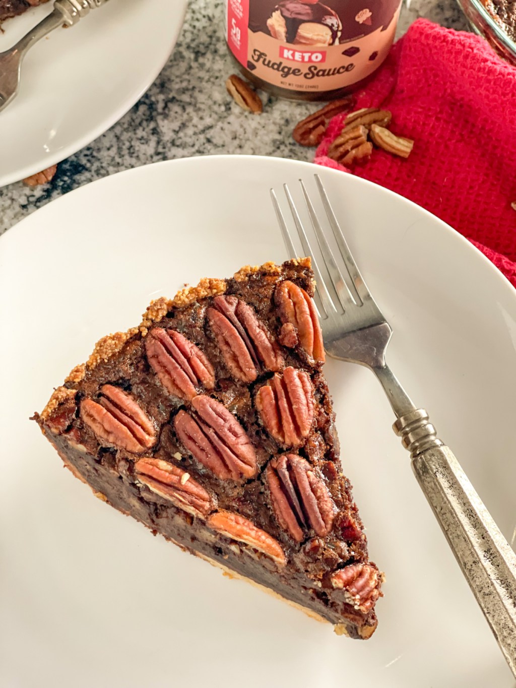 plated slice of keto chocolate fudge pecan pie