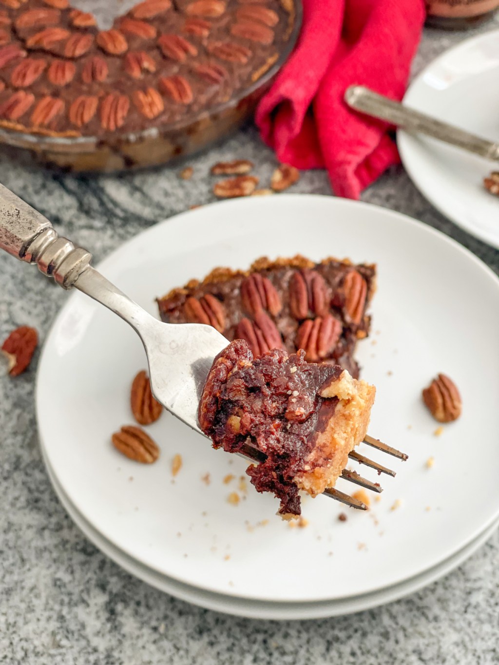 close up bite of keto chocolate fudge pecan pie