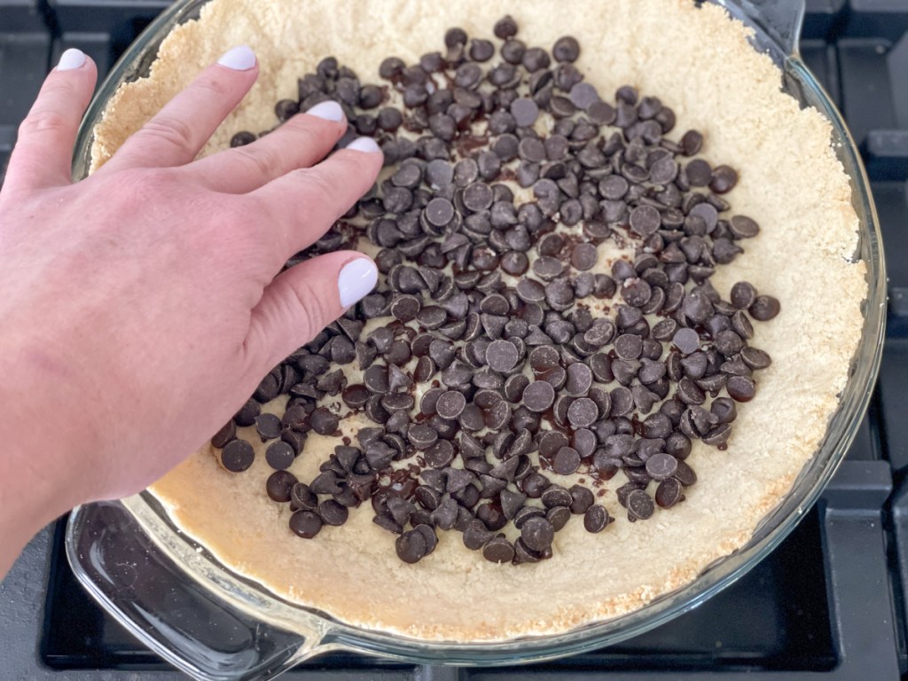 chocolate chips on a keto pie crust