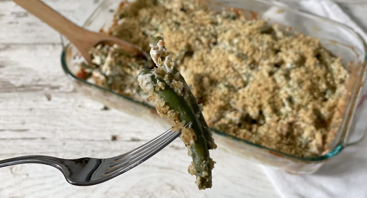 a fork with some keto green bean casserole on it