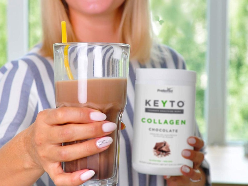 holding a drink made with chocolate collagen
