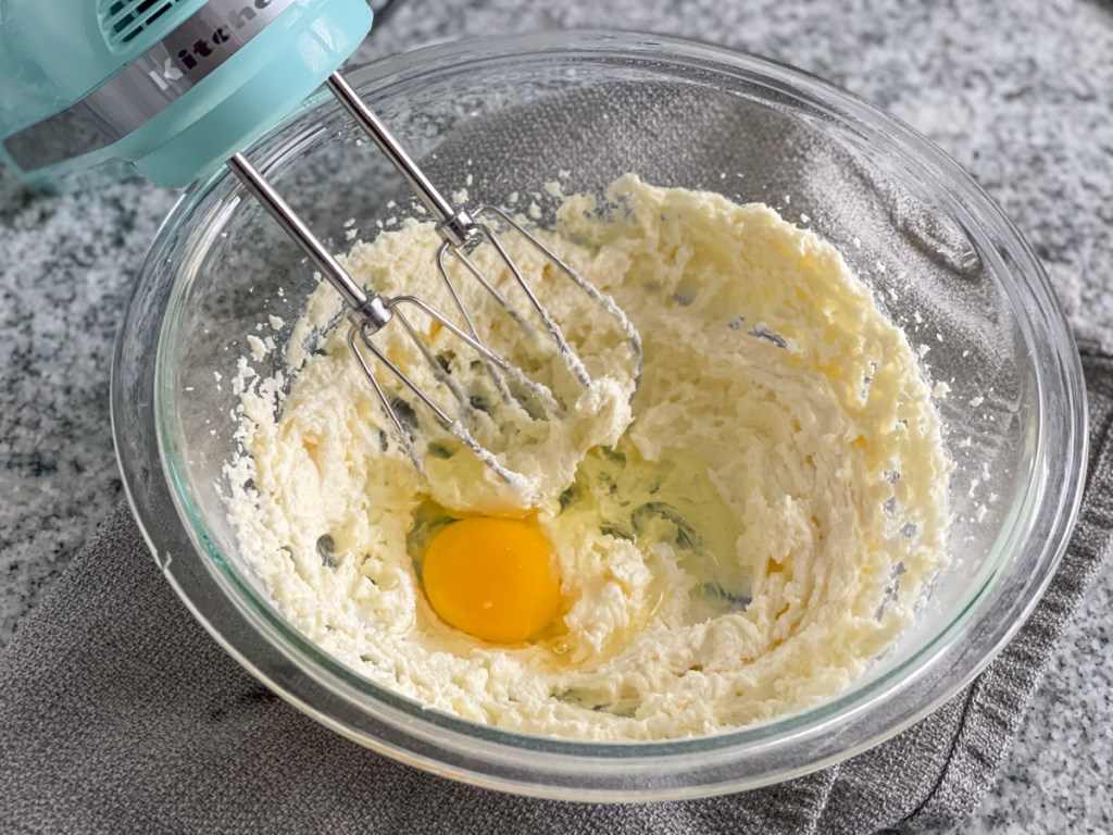 beating together butter, keto sweetener, and egg