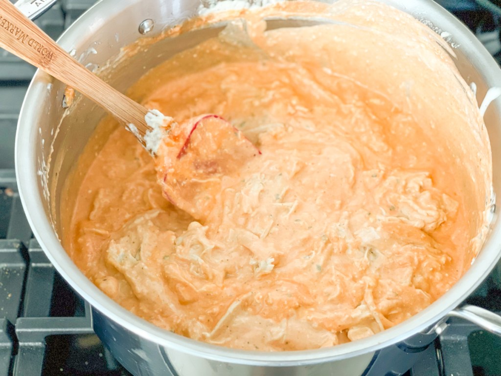 buffalo chicken mixture in a saucepan