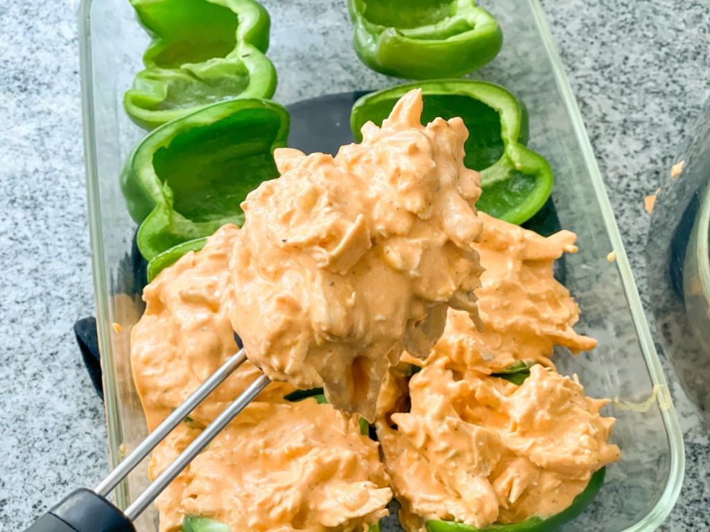 Scoop of buffalo chicken mixture to put in bell pepper