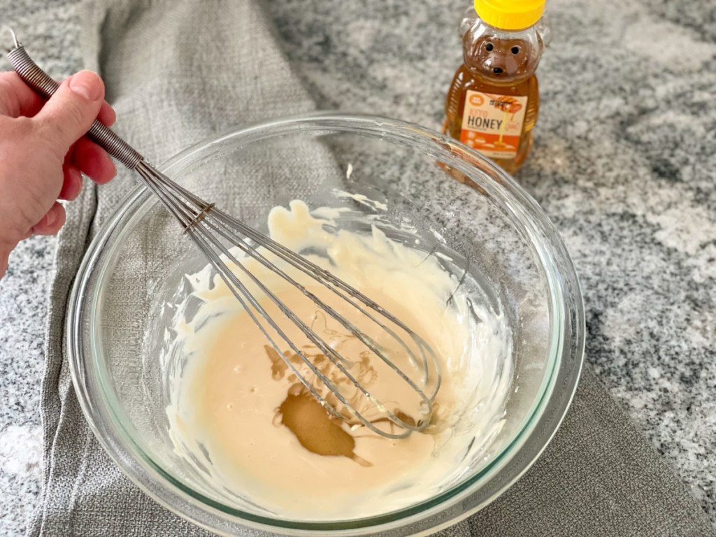 mixing choczero keto honey into a glaze