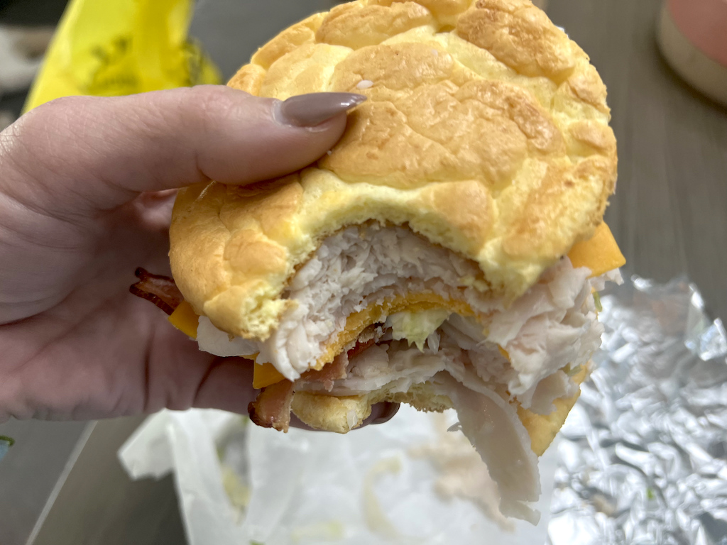 holding cloud bread sandwich from Which Wich