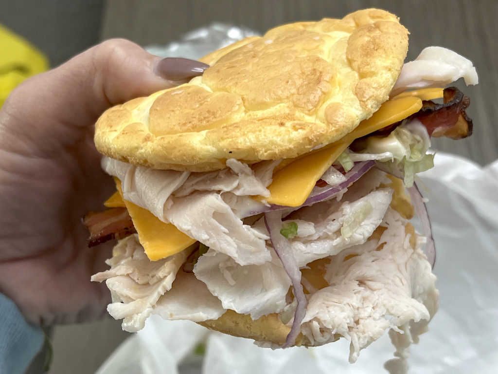 holding Which wich could bread sandwich 