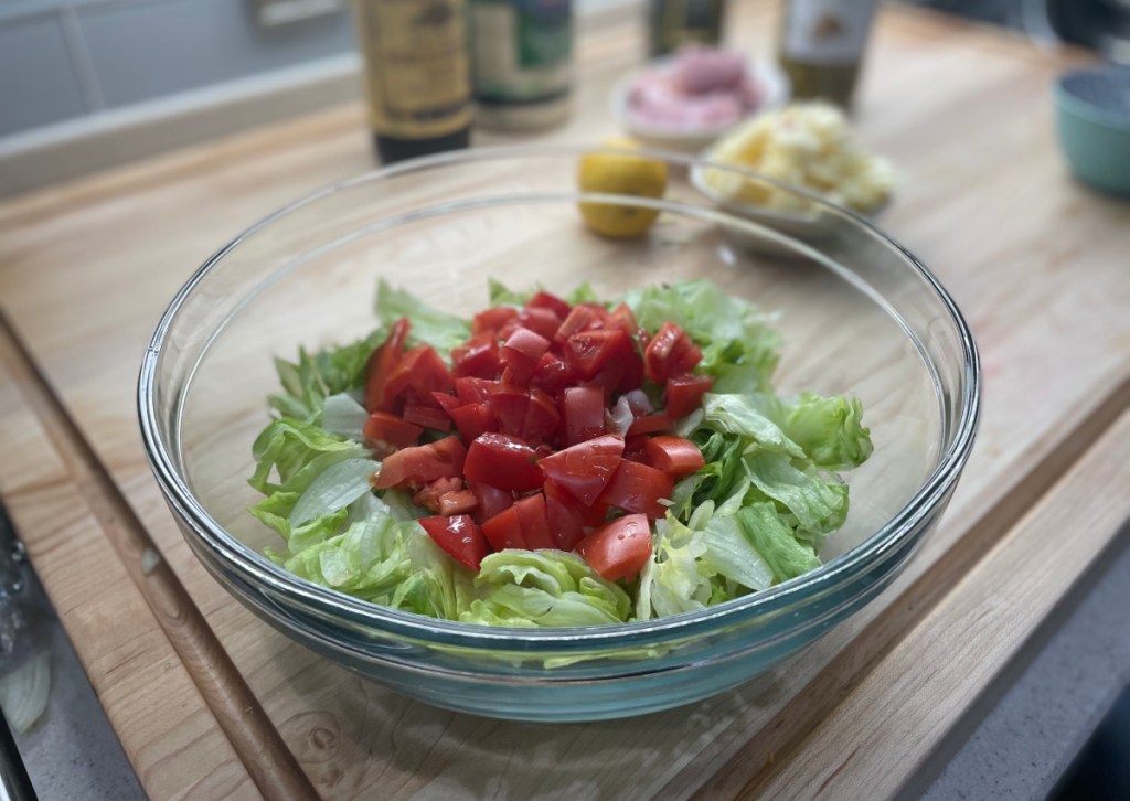 a bowl with salad lettuce and tomatoes