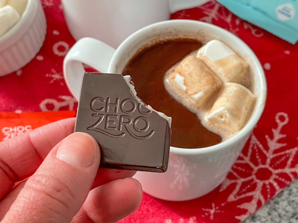choczero peppermint chocolate square with a bite out of it with keto hot cocoa 