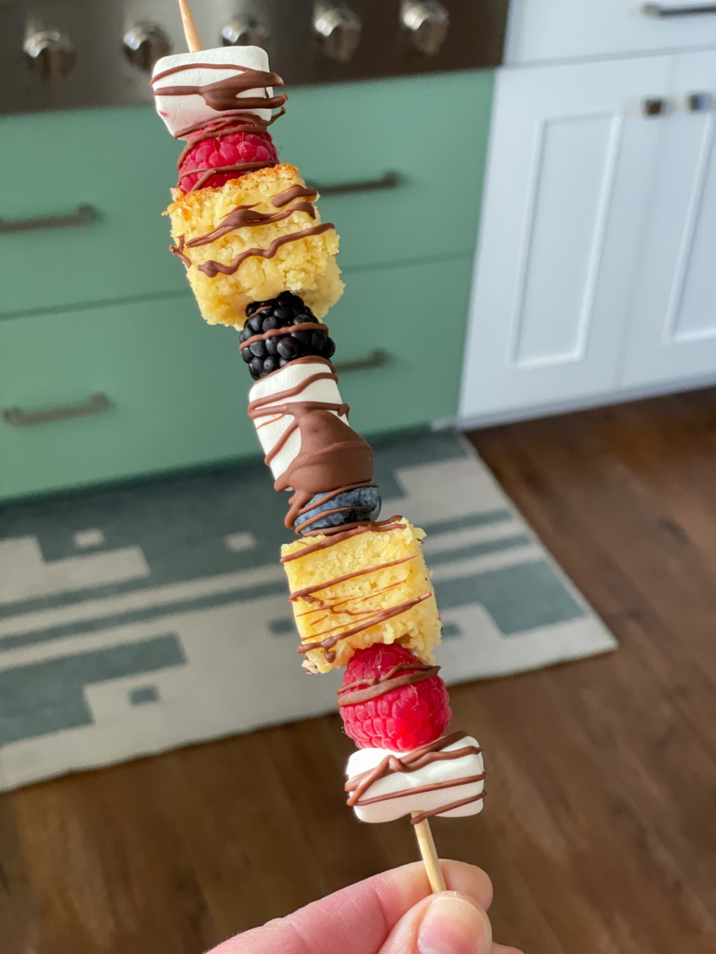 holding a dessert kabob