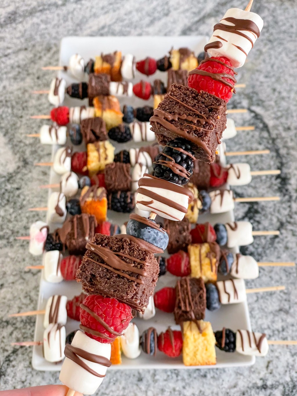 holding a dessert kabob