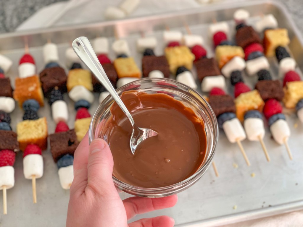 holding a bowl of melted chocolate