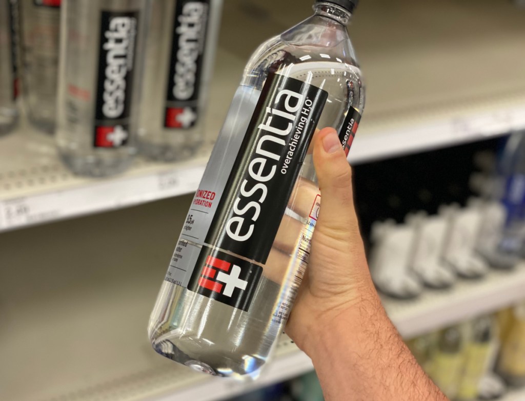 Man holding a bottle of keto-friendly Essentia water