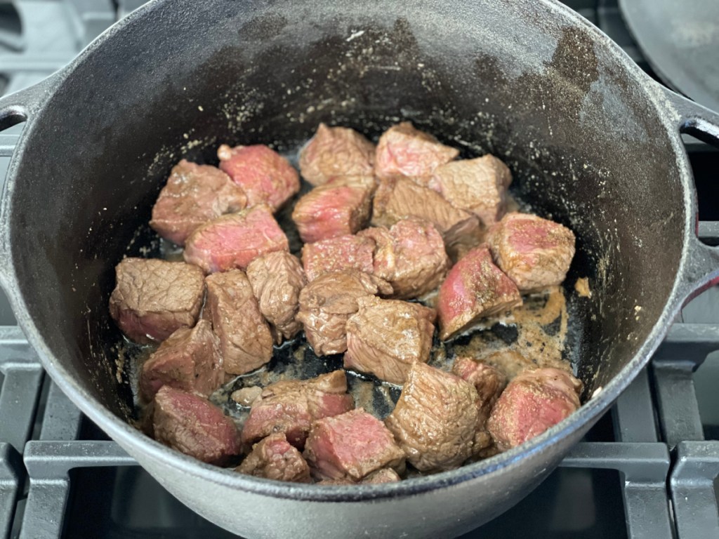 browning beef tips in a Dutch oven