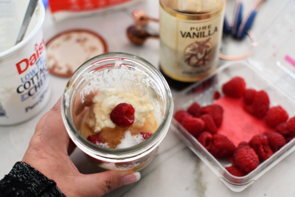cottage cheese in a jar with raspberries
