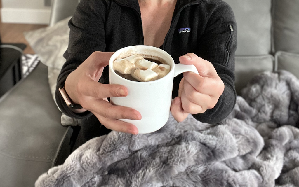 drinking keto hot cocoa with blanket 