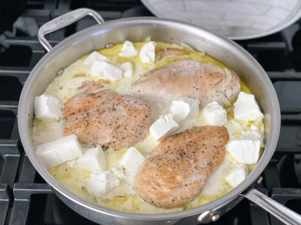 cream cheese in a skillet with chicken