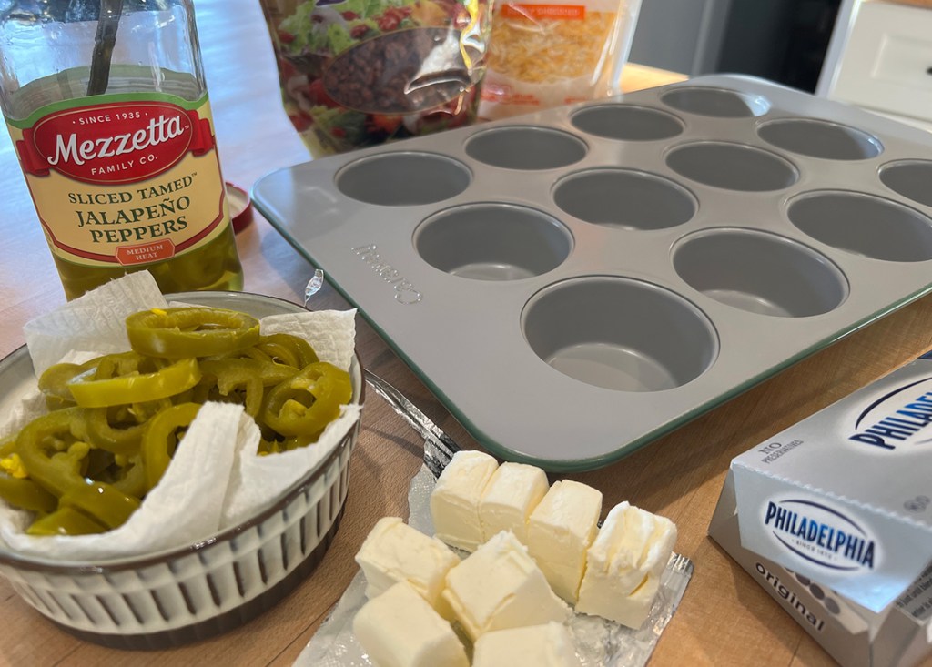 ingredients to make keto jalapeno bites next to cooking tray