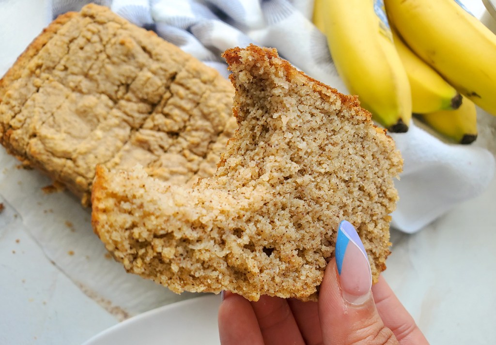 hand holding slice of keto low carb banana bread