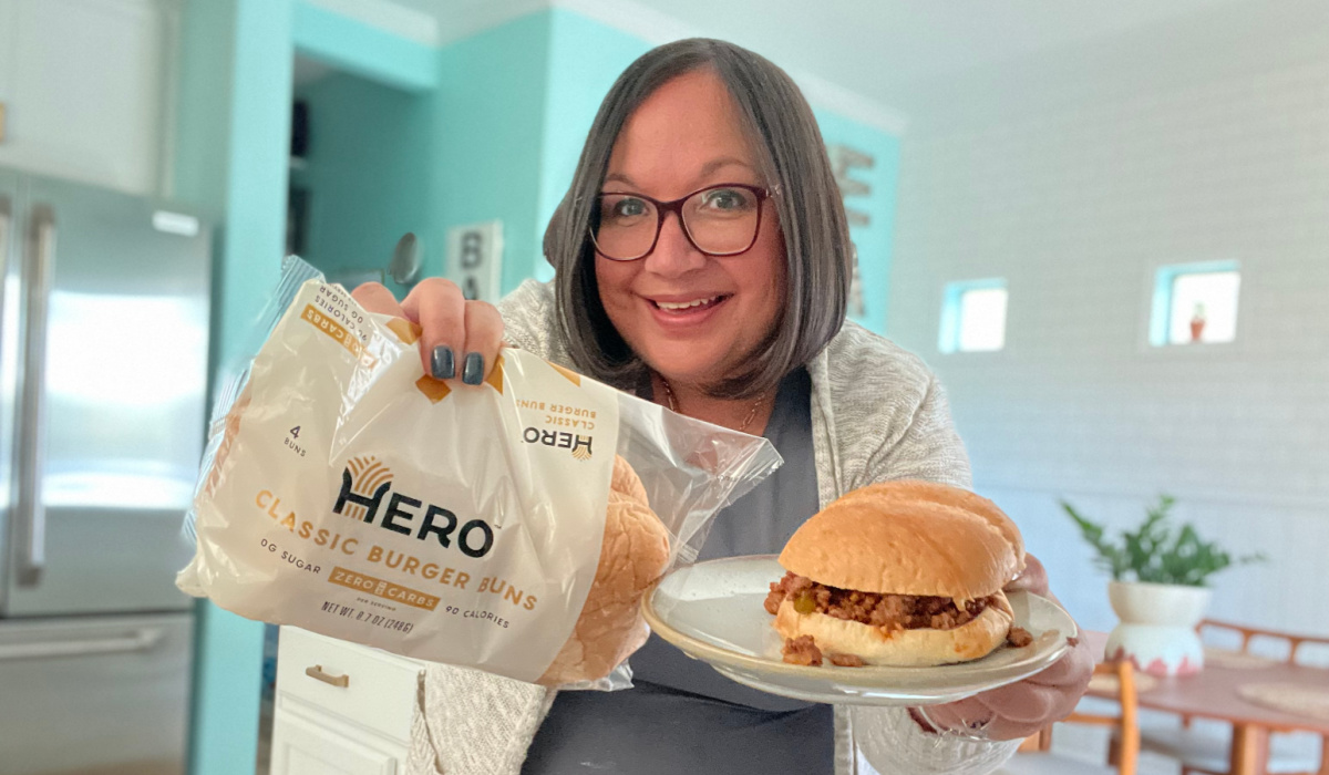 woman with hero bun package and keto sloppy joe sandwich 