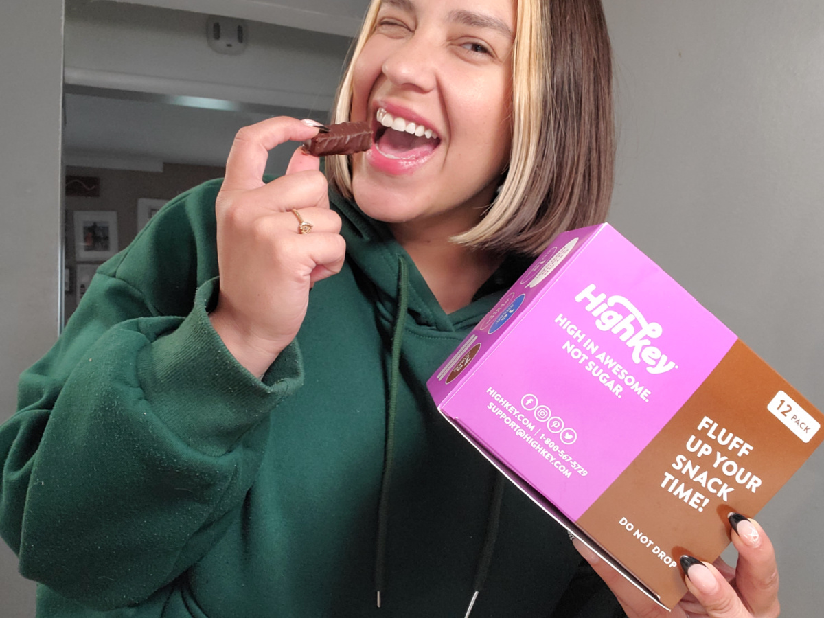 Woman eating a high key low carb keto candy bar
