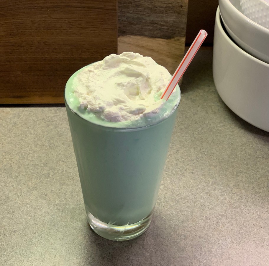 a low carb Keto Shamrock Shake with a straw