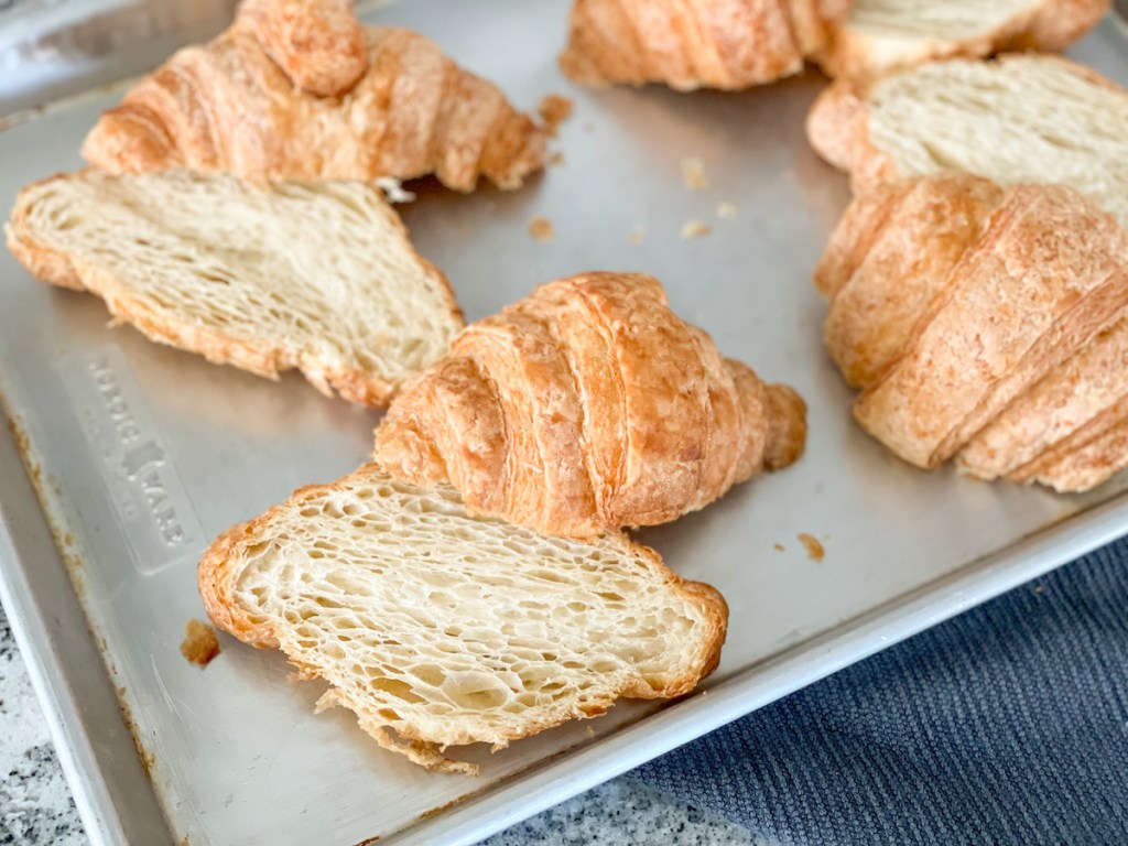 Hero Bread Croissants cut in half on a baking sheet