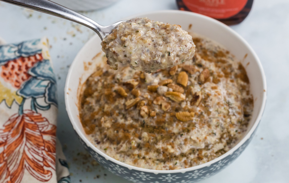 A spoonful of low carb oatmeal made with chia seeds, flax seeds, and keto maple syrup