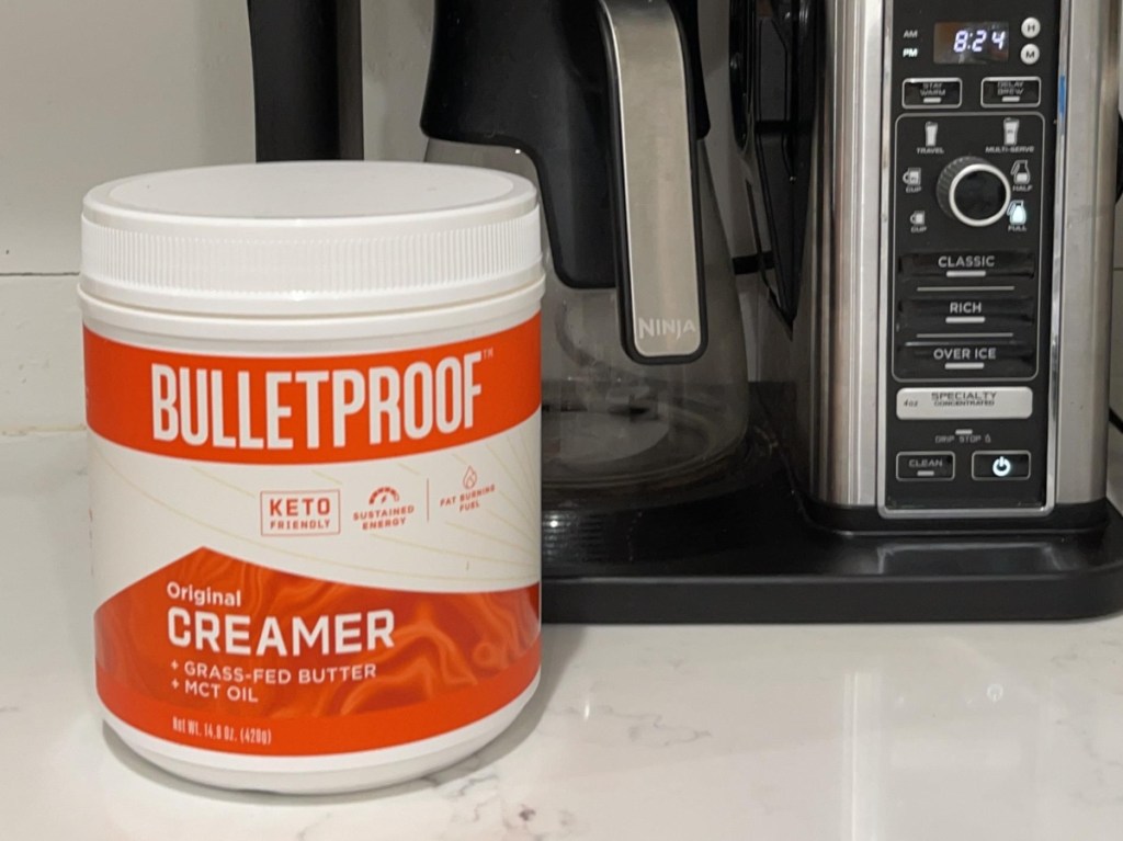 canister of Bulletproof creamer next to coffee pot