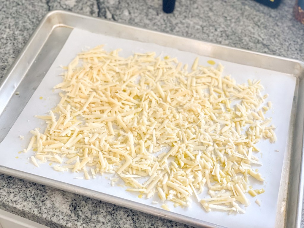 shredded parmesan on a baking sheet