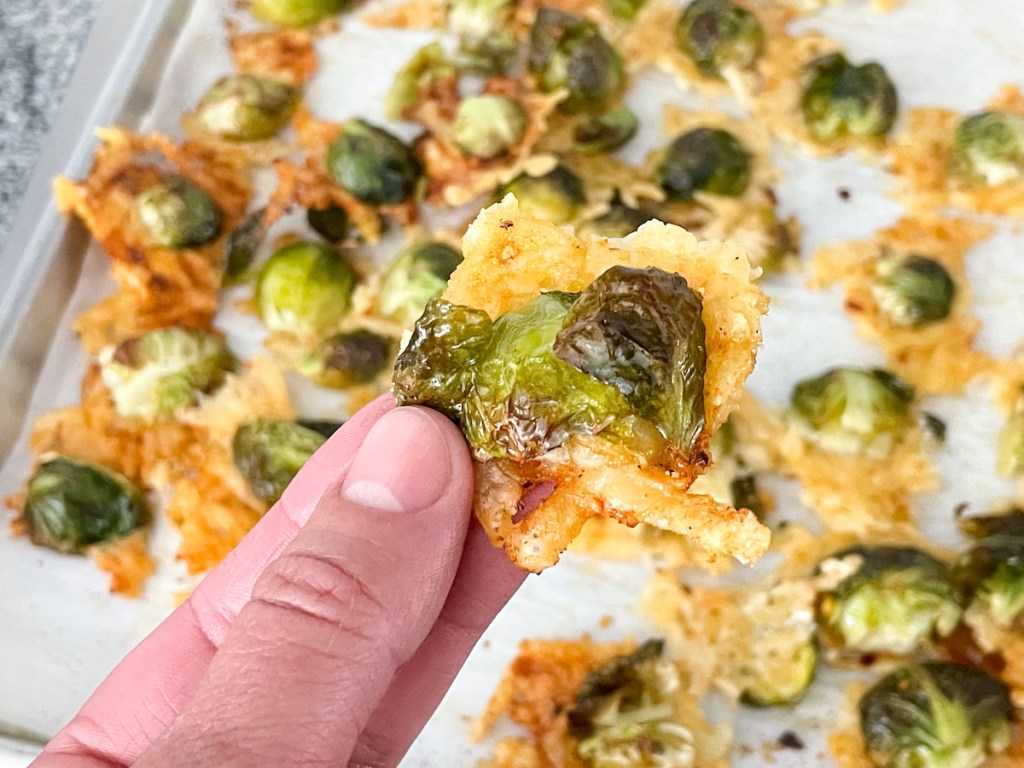 holding a roasting parmesan brussels sprout