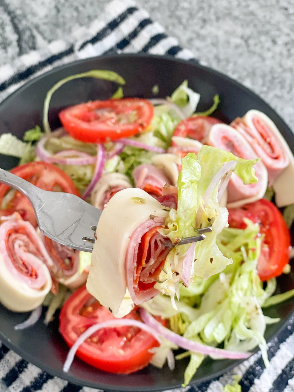 bite of sub in a tub on a fork