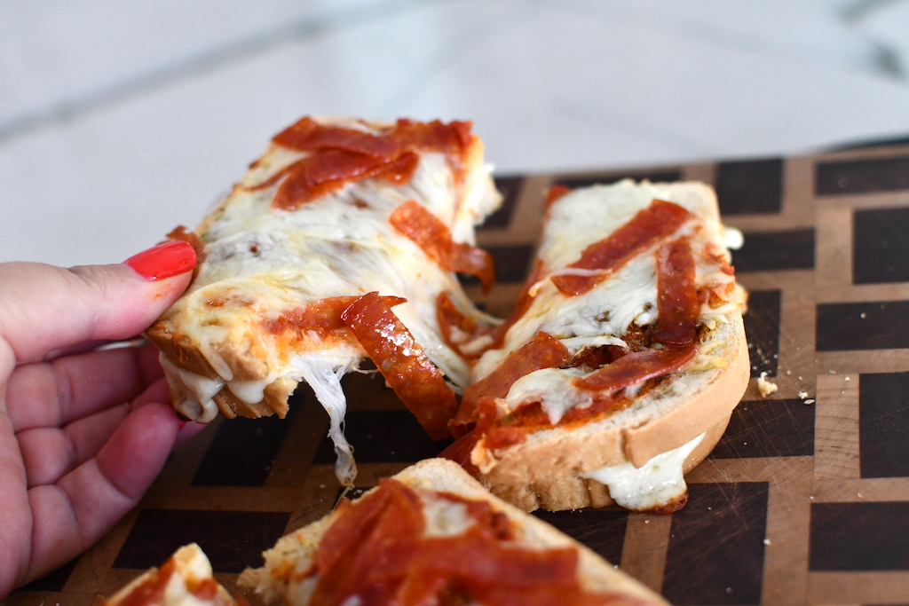 holding keto bread pizza toast 