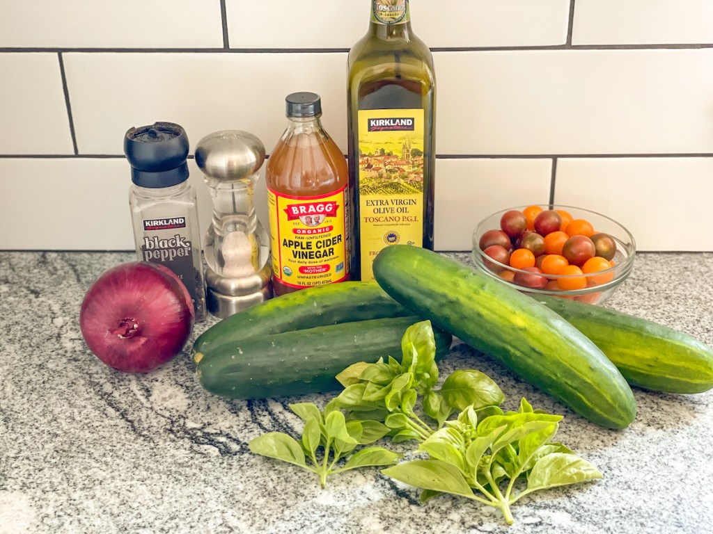 keto cucumber salad ingredients on a countertop