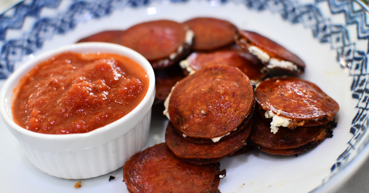 pepperoni bites on a plate which is a similar recipe to pepperoni cream cheese bites