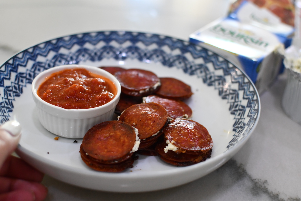pepperoni bites on plate with sauce 