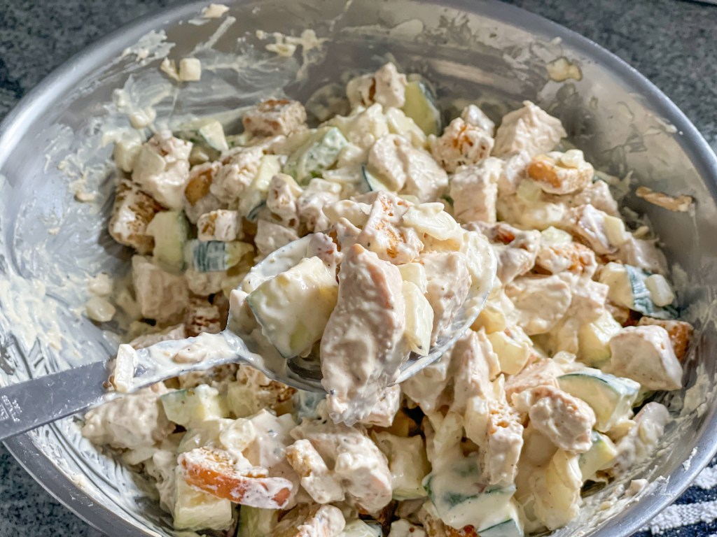 bowl with keto croutons, chicken, zucchini, and onion mixed together