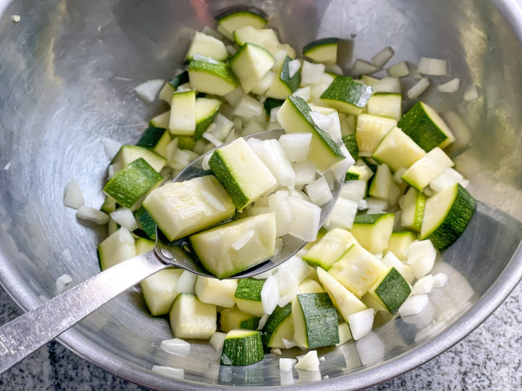 chopped zucchini and diced onion in a bowl