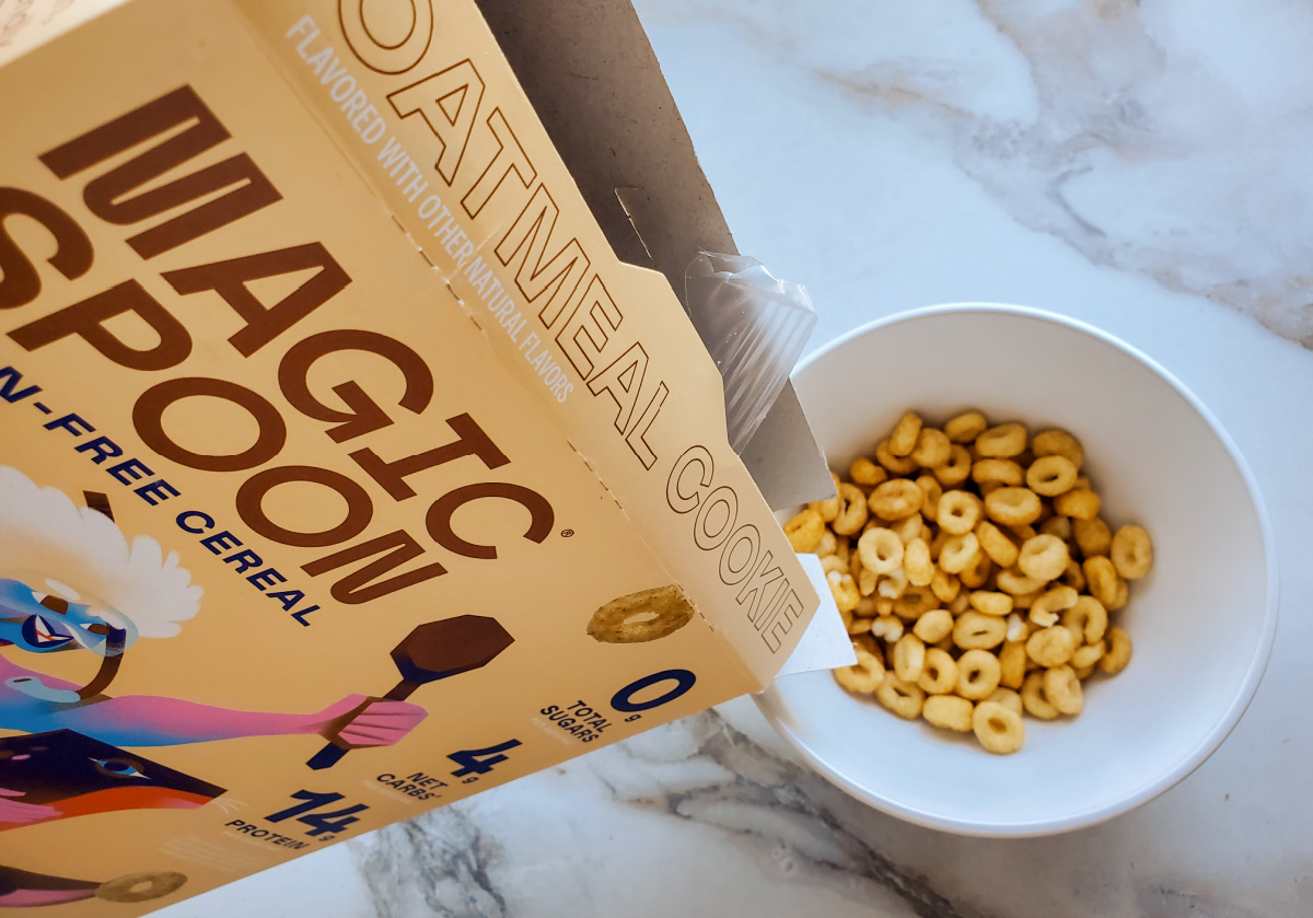 pouring in keto cereal from magic spoon box