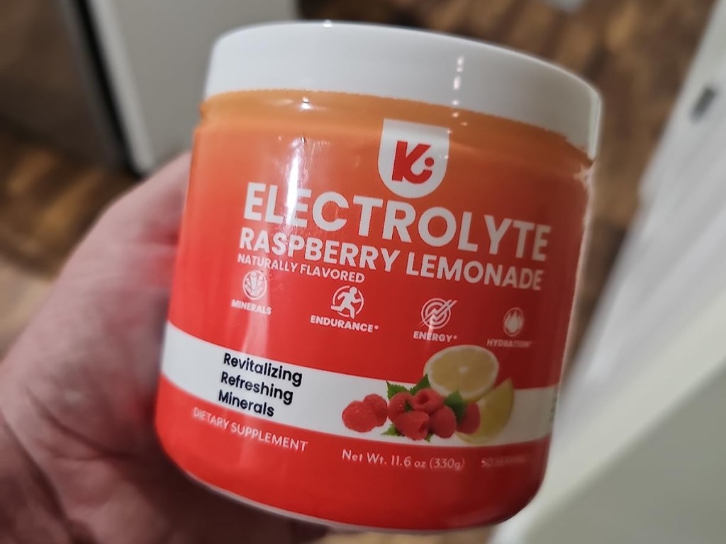 holding a small tub of electrolyte powder
