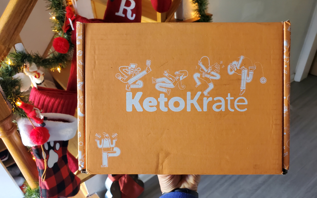 keto krate december box in from of stockings
