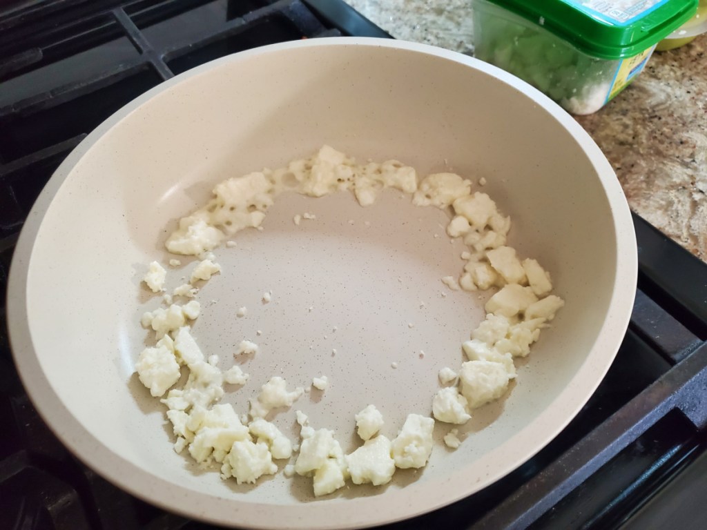 putting feta in a skillet