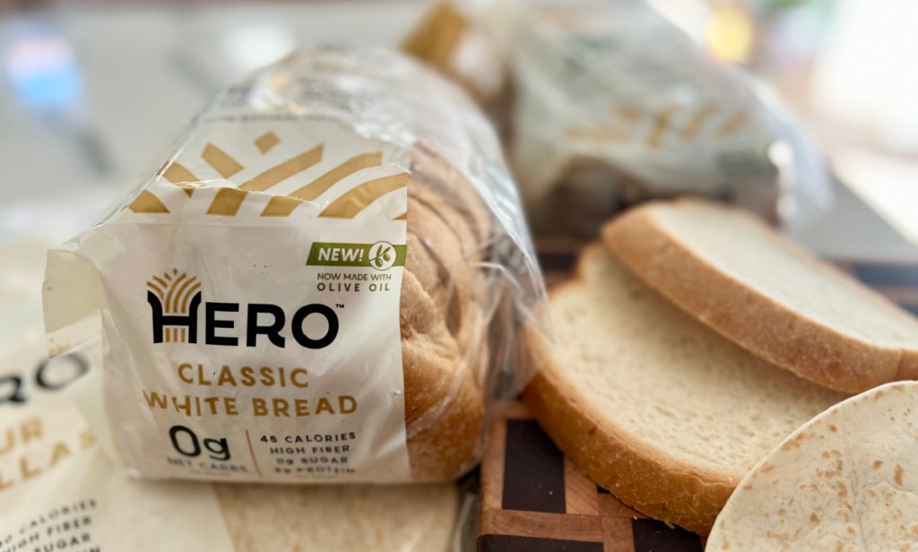 A loaf and two slices of Hero Classic White Bread Made With Olive Oil