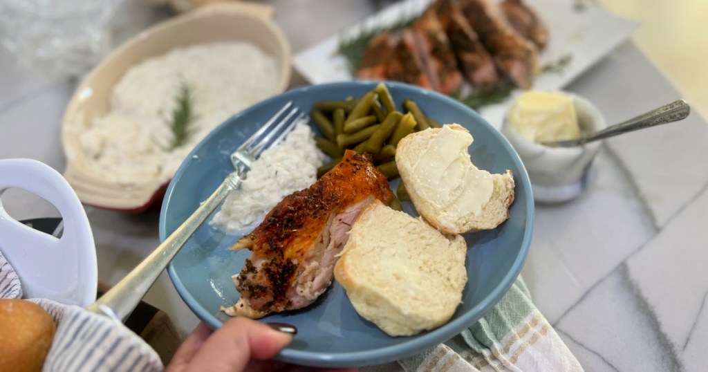 plate with turkey, hero roll, cauliflower, and green beans