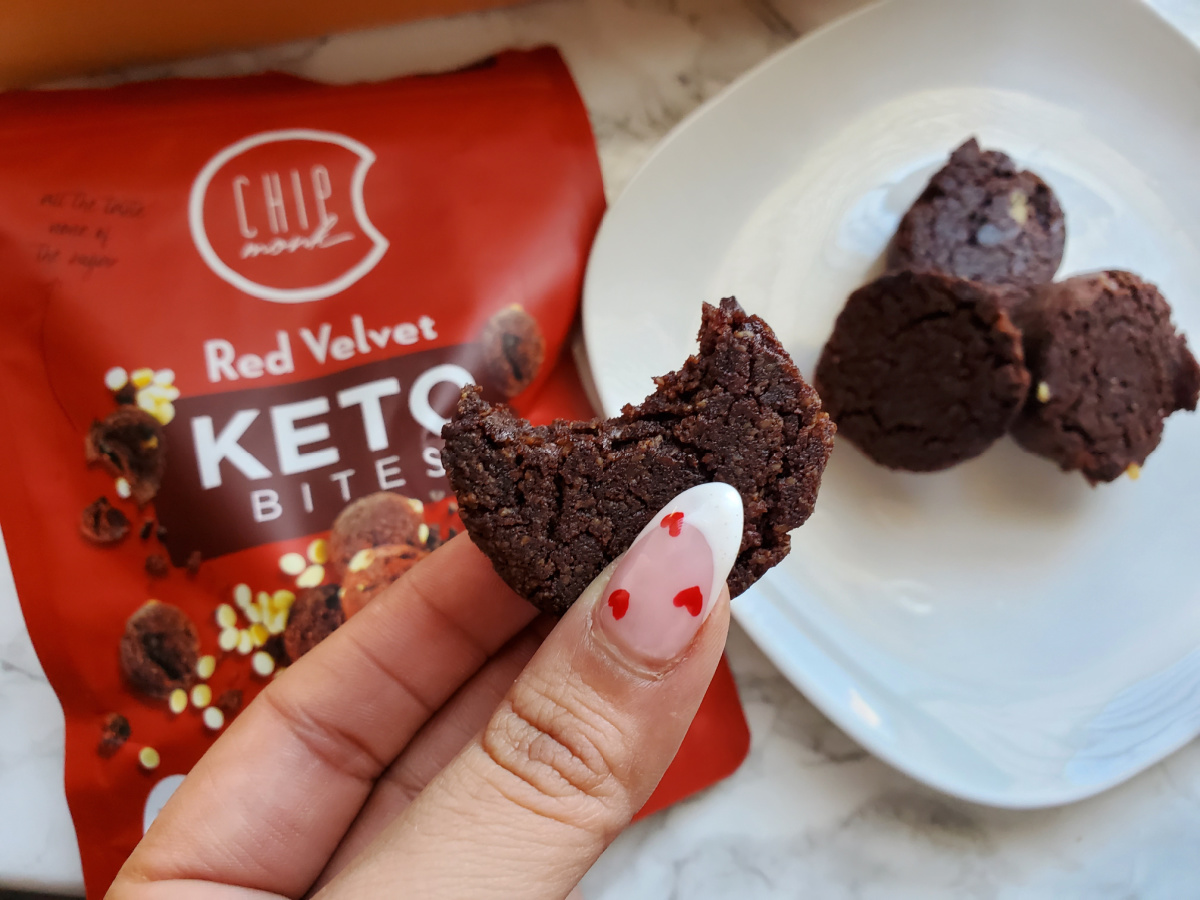 hand holding ChipMonk Red Velvet bites which are keto snacks included in the february 2024 keto krates
