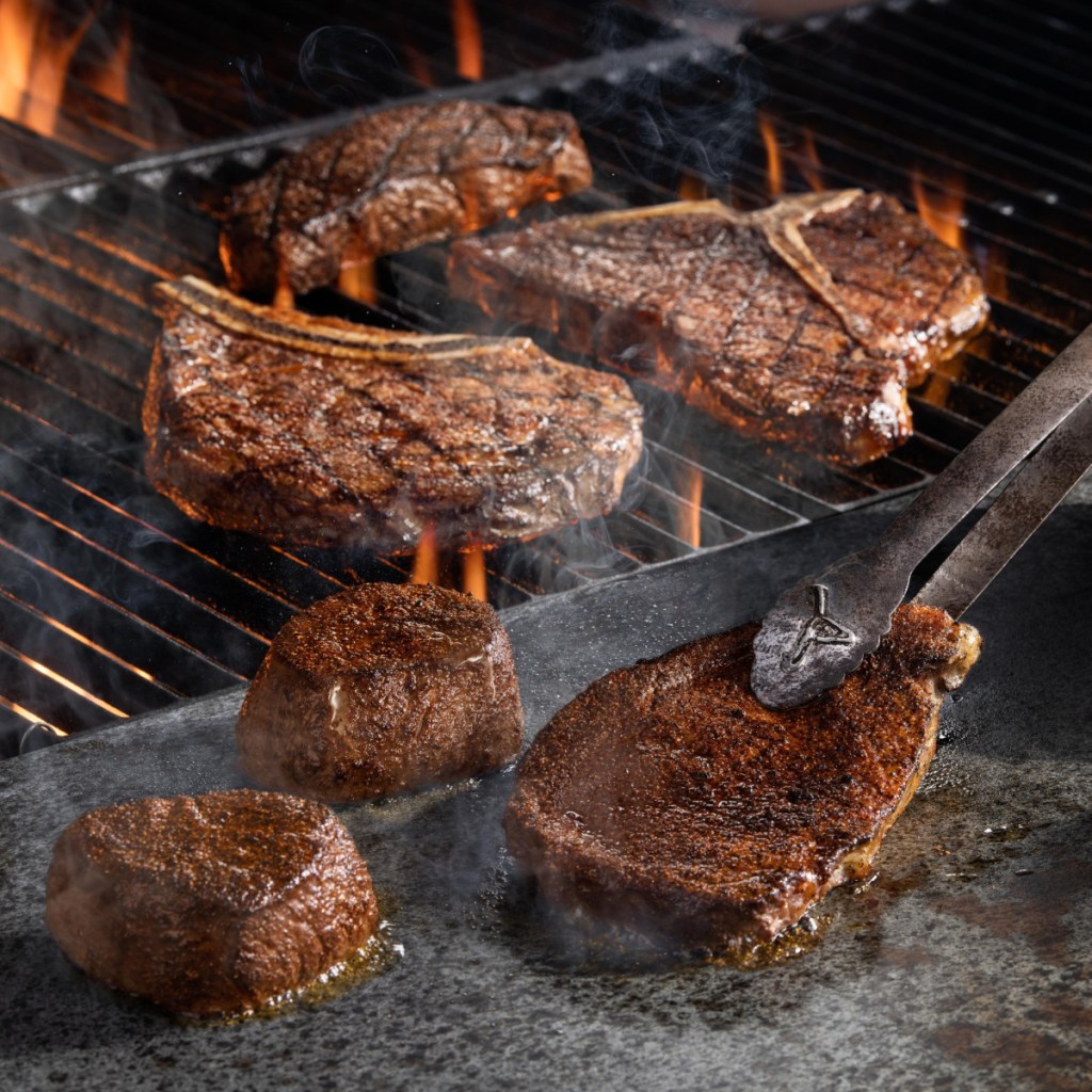 steak on the grill at longhorn steakhouse, one of the places with keto birthday freebies
