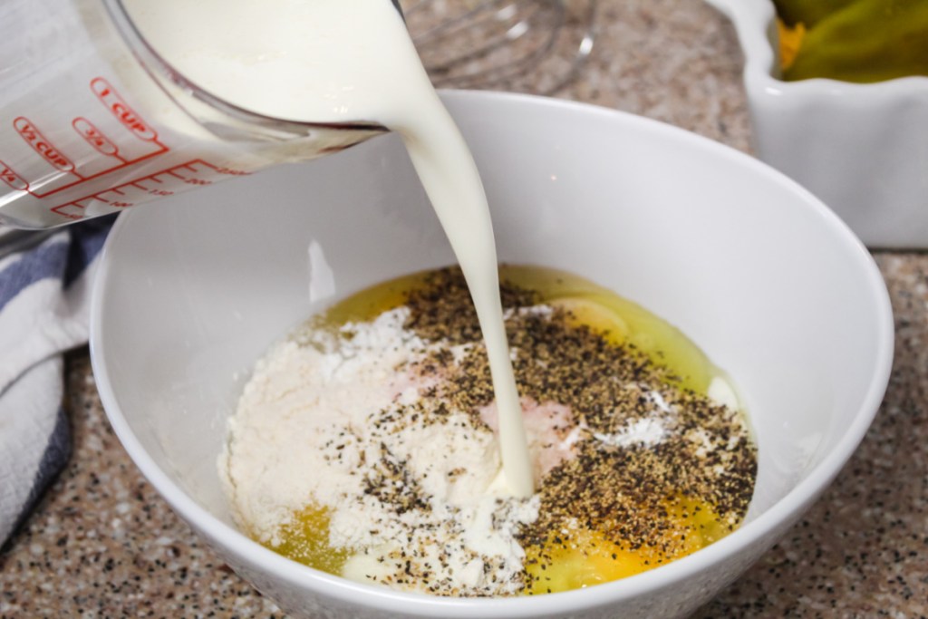 Pouring Cream into an egg mixture